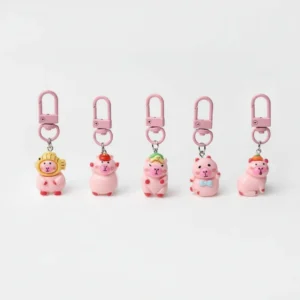 Set of 5 pink resin capybara keychains with matching pink clasps on a white background.