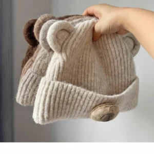 4 colors of fleece-lined capybara beanies with cute button noses.