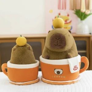 brown capybara plush with an orange on its head sitting inside a removable orange coffee cup plush toy