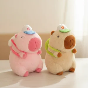 Two fluffy capybara plush toys sitting side by side, one pink and one brown, both wearing baseball caps and small backpacks. pink and brown capybara plush toy with baseball cap