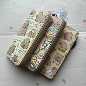 Group of three long zip-around capybara wallets standing upright, displaying yellow snack print, green retro cafe print, and cream bakery print designs.