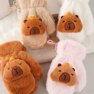 Set of four fuzzy kids mittens in brown, beige, white, and pink, each featuring a capybara face with a small orange on its head and a connecting neck string.