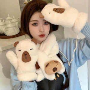 A winter accessory set featuring a plush capybara cross-scarf and matching mittens on a string, shown in soft faux fur material.