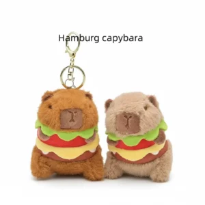 Two sitting capybara burger plush keychains in brown and beige colors, showing gold metal clasps.