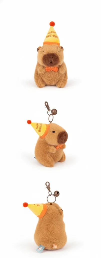 Back of the stuffed capybara showing the metal lobster claw clasp and the small round jingle bell attachment.