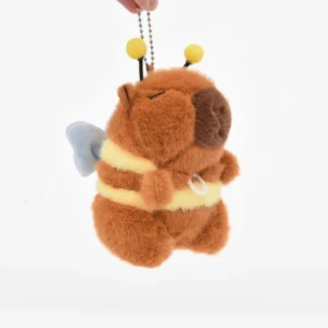 Front view of capybara bee plush showing the white pull-ring on the chest that triggers the wings.